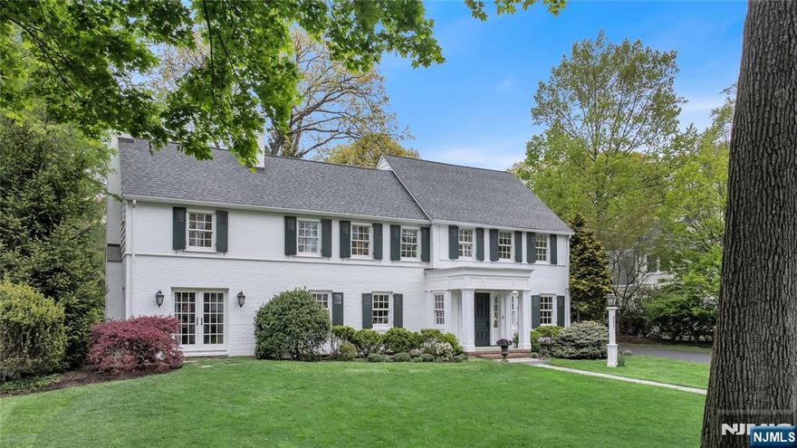 Stately Willard Colonial blending classic elegance with modern luxury, set on one of Ridgewoodâ€™s premier streets. A gracious entry hall introduces beautifully flowing main living spaces, including a formal dining room, expansive living room with wood-burning fireplace and built-ins, and a refined study with coffered ceilings, gas fireplace, and two sets of French doors-one opening to a private covered patio, ideal for working from home. The custom gourmet eat-in kitchen features a center island, built-in desk, and dining area, that opens seamlessly to a stunning family room with gas fireplace, intricate millwork, window seats, and double arched French doors leading to a bluestone patio and covered porch for effortless indoor-outdoor living. There is an elegant hall PR room plus a well-designed mudroom with access to the kitchen and backyard for added convenience. Upstairs, the primary suite offers a luxurious retreat with a custom dressing area, accessory closet, and spa-like bath with radiant heat and dual vanities. 3 additional bedrooms include one ensuite, plus a hall bath-both with radiant heating. The third floor provides a private bedroom and full bath, perfect for guests or flexible living space. The finished lower level expands the home with a recreational room, gym, wine cellar, craft area, and laundry. Ideally located near top-rated schools, the train, and NYC transportation, this home delivers exceptional comfort, style, and convenience.