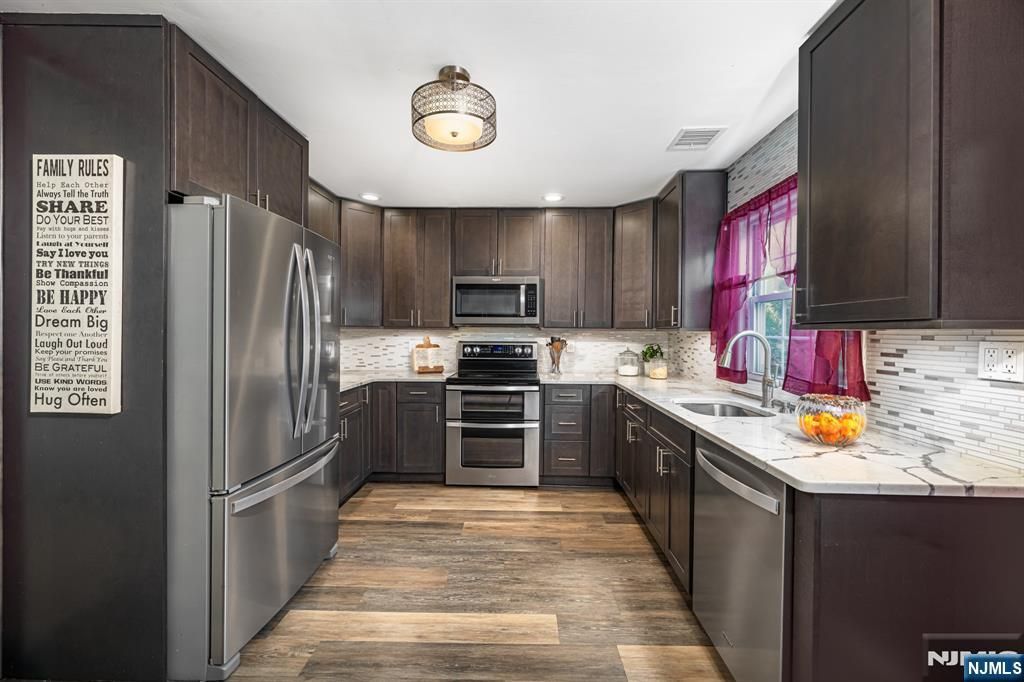 Photo of 153 Howard Avenue, Rochelle Park, NJ 07662 (MLS # 26013814)