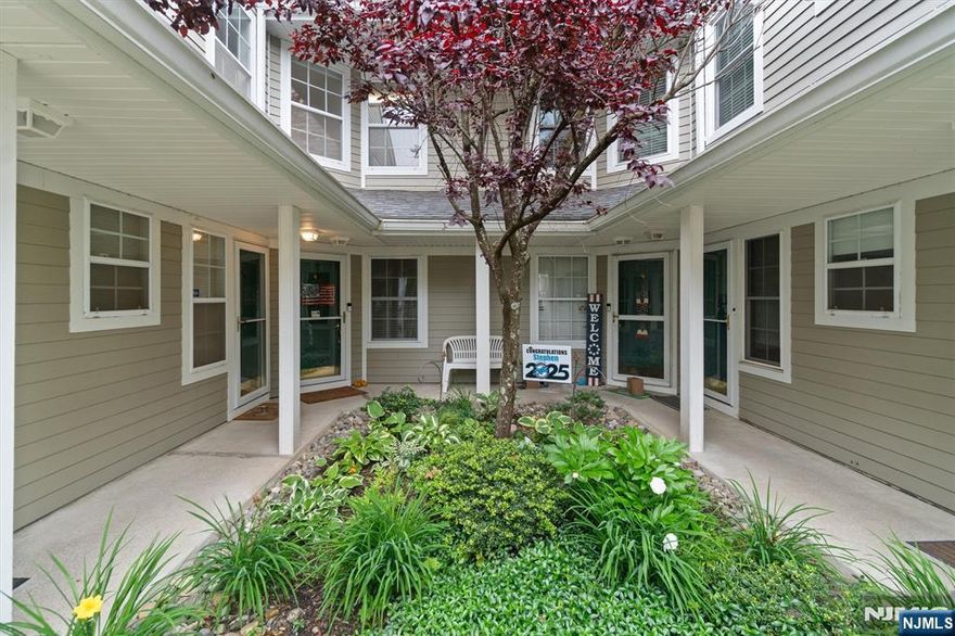 Welcome to this beautiful 3-bedroom, 3-bath Mahwah townhome offering approximately 1,636 sq. ft. of comfortable living space. Tucked away with no through traffic, this home backs to a serene tree-lined view, offering peace and privacy from your rear balcony. Inside, you'll find an eat-in kitchen with stainless steel appliances, a separate dining area, and a living room with vaulted ceilings and a gas fireplace with direct access to the balconyâ€”perfect for relaxing or entertaining. The main level also includes a generously sized primary bedroom with an en-suite bath, a second bedroom, a full hall bath, and convenient laundry facilities. Upstairs, a versatile loft area with a closet, leads to the third bedroom and another full bath. Bright and airy with lots of closet space, this home is move-in ready! Located in the highly desirable Paddington Square community, you'll enjoy access to amenities including a clubhouse, pool, playground, and a variety of neighborhood activities.