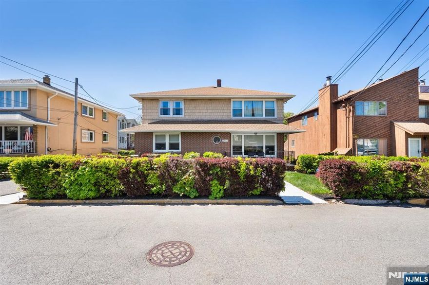 This expansive legal 3 fam offers a rare combo of significant scale and income potential. Tucked away in a quiet corner of Fort Lee, this 3,884 sf home is meticulously maintained & a powerhouse for both investors and the owner occupant. Unit 1 features 2 beds & 1 bath with an updated kitchen (2025), and long term, reliable tenants. Unit 2 is features an open-concept living/dining area anchored by a fully renovated kitchen (2025) boasting granite counters & a large center island. With hrdwd floors throughout, this level includes 3 beds & 2 full baths. The 3rd unit offers 3 beds & 2 full baths and kitchen w/ refinished cabinets (2025). Parking is never an issue with a rare setup including an attached 2 car garage, a detached 1 car garage, & add'l lot fitting up to 4 cars behind the house. Two sets of washers/dryers are in the main garage & separate utility metering with two gas, electric, & water meters. Whether you're looking to live in one unit while offsetting your mortgage or seeking a high-yield rental property, the infrastructure here is designed for seamless management and convenience. Situated just blocks from the vibrant "Hudson Lights" district, residents are minutes away from upscale dining, iPic theaters, and chic shopping. For the commuter, you'll be less than a mile form the GWB. Enjoy the suburban feel of a residential neighborhood with the urban convenience of being a stone's throw from Manhattan, all while benefiting from Fort Leeâ€™s community amenities.