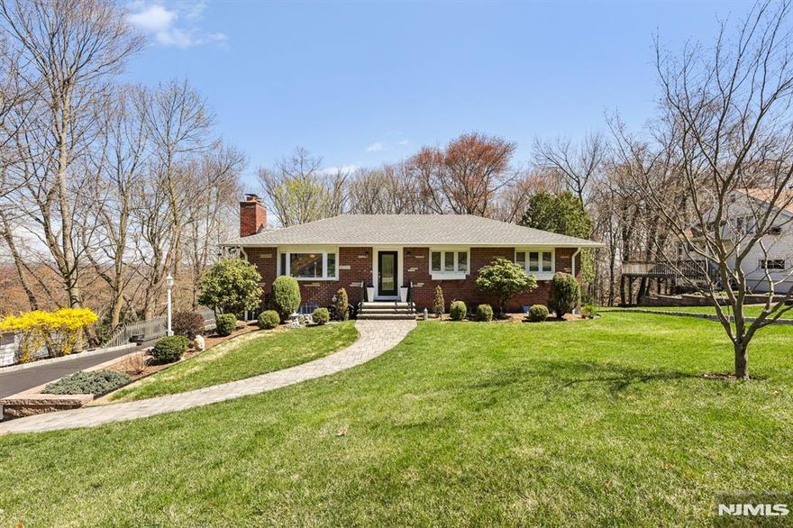 The Heights awaits! This beautifully updated 3-bedroom, 2.5-bath ranch blends effortless comfort with timeless style inside and out. Tucked away on a private lot along one of the neighborhood's most coveted streets, this home offers the perfect balance of serenity and convenience.Step inside to find gleaming hardwood floors throughout, elegant crown molding, and a gracious living room anchored by a classic wood-burning fireplace. The modern kitchen has been tastefully updated for today's lifestyle, while central A/C ensures year-round comfort.Practical upgrades provide peace of mind, including a newer roof and gutters, generator hook-up, and an attached, heated two-car garage. The finished walk-out basement complete with vinyl flooring and a half bath adds versatile bonus space ideal for a home office, gym, or recreation area. Out back, a spacious two-tiered deck sets the stage for effortless entertaining or quiet evenings under the stars. And the expansive rear family room? That's the icing on the cake.Enjoy close proximity to all that Bergen County has to offer, including the charming downtown of Hawthorne and convenient NJ Transit train access yet come home to a setting that feels miles away from it all.Whether you're downsizing or planting roots, this one is a slam dunk.