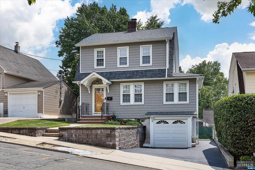 Beautiful MIC Spacious 3 BR colonial showcasing true pride in ownership. 1st Floor offers a welcoming long LR w/a secluded office nook & wood burn FPL having an electric blower insert. The FDR is great for entertaining in/out equipped w/french doors leading to deck & yard. 2017 EIK w/granite counters, top notch Samsun appliances & separate dining area w/lg bow wdw facing yard. 2nd floor hosts 3 BR's, linen closet, new 2017 Bath, & hallway access to w/up stg attic w/attic fan. Bsmt is dry, being used for storage (while packing) has a 1/4 bath with great potential & garage access. Perfect home offering hdwd floors, a lifetime warranty new roof, new siding, electric garage door, upd. windows, new 200-amp elec. system, updated wiring, HW Heater, new exterior gas meter along w/a brand new 2022 copper water & gas line going onto street. Quick walk to NYC Express Bus, local shopping, grammar school & a quick drive to all major HWYS, major shopping malls & Hack Med Center & HN Hospital.