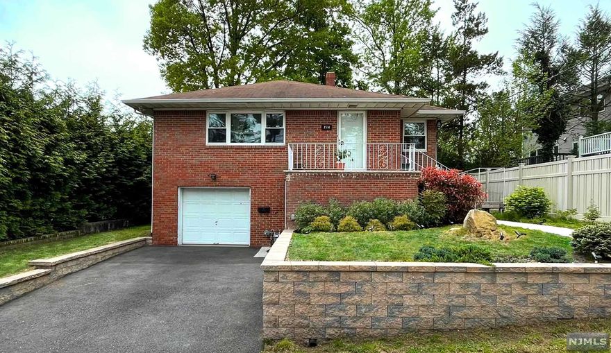 Retreat from the busy city to this cozy home in Palisade Gardens, one of the most desirable sectors of Fort Lee. This Raised Ranch has been renovated to bring back its old charms in a modern approach. This 5-bedroom home has so much to offer. Entering the foyer on the top level, you will find a beautiful open concept floor plan - hardwood flooring throughout both the living room and formal dining room. The fully renovated kitchen features elegant quartz countertops surrounded by white custom wood cabinetry and stainless steel appliances. On the same level are two generous size bedrooms and a full bathroom with a jacuzzi and standing shower. Entering the ground floor foyer, vinyl plank flooring flow into the family room followed by a powder room, laundry room, full bathroom and three bedrooms. Large size walk-in closet will give you extra storage space. In addition, a new washer, dryer, A/C system, water heater and more. Enjoy a nice barbecue on the patio area in the backyard.