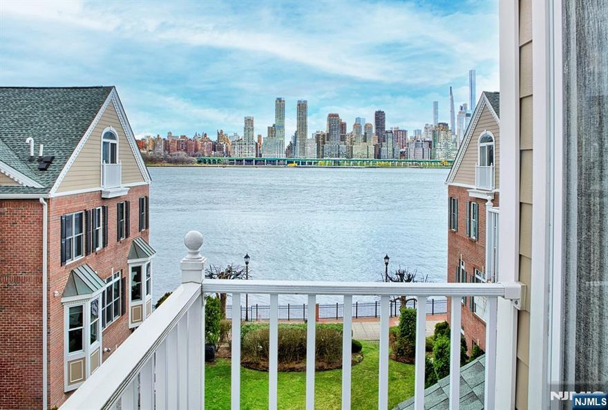 Jacob's Ferry stellar Fanwood style home with views of NYC!! Three balconies and a patio. Kitchen boasts Quaker Maid mahogany cabinets, silestone countertops, and stainless steel appliances. Custom painted. Crown molding. Luxury flooring throughout. Recessed and custom lighting. Bottom level features totally renovated full bath. Both full baths on third floor renovated. California closets. Parking for two cars; one in private garage and one in driveway. Community features two pools with jacuzzis, waterfront promenade tot lot and free shuttle to ferry. Steps to 158 bus to NYC. Close to restaurants and shopping. The Epitome of Waterfront Living!!!