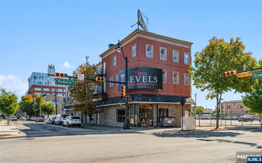 Price Adjustment to reflect a 6.25% CAP RATE. A rare opportunity to acquire a fully income-producing mixed-use property in the heart of Downtown Newark's Arena District, steps from the Prudential Center and Mulberry Commons Park. 218 Mulberry Street offers immediate cash flow with significant long-term upside in one of Newark's most active redevelopment corridors. The property features a strong commercial anchor tenant generating approximately $240,000 annually, plus four residential units above, providing a diversified income stream with total annual income of approximately $349,200 and a net operating income of approximately $291,900. Operating expenses are low, tenants pay all utilities, and the property is owner-managed. All leases are month-to-month, offering incoming ownership flexibility to lock in long-term leases, optimize rents, or reposition the asset. Located within a major redevelopment zone surrounded by substantial public and private investment, the property is widely regarded as a strategic parcel in the continued transformation of Downtown Newark. Ideal for 1031 exchange buyers, long-term hold investors, value-add strategies, or assemblage-minded buyers seeking stable income today with meaningful future potential.