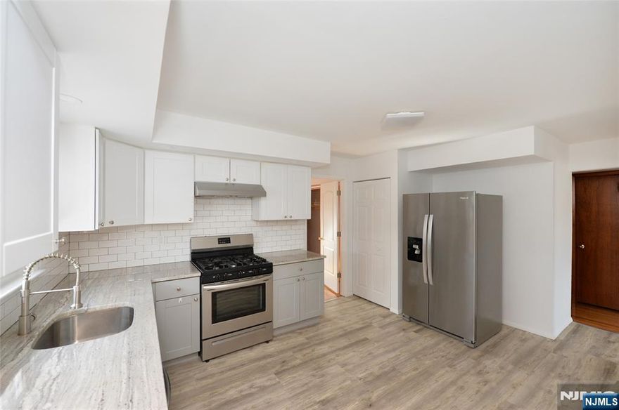 Welcome to this charming 3-bedroom, 1-bathroom second-floor apartment nestled on a quiet cul-de-sac in Elmwood Park. As you walk up, youâ€™re greeted by a stunning modern eat-in kitchen featuring stainless steel appliances, ample cabinetry, and space for a stacked washer and dryer with hookups already in place. Just off the kitchen is a bright and spacious living room, perfect for relaxing or entertaining. The apartment also offers three comfortably sized bedrooms and a newly renovated full bathroom, combining style and functionality throughout. Located just steps from a nearby park, this home offers a peaceful neighborhood setting while still being incredibly convenient. Elmwood Park is known for its great local dining, neighborhood shops, and easy access to major highways, making commuting simple. With convenient transportation options to NYC and close proximity to surrounding Bergen County towns, this location offers the perfect balance of suburban comfort and city accessibility.