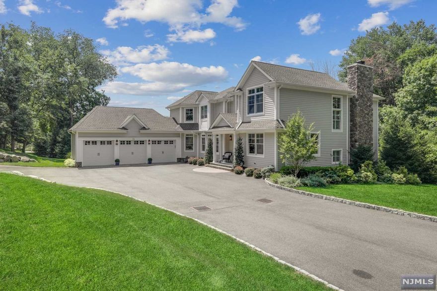 Perfection inside and out! Tucked away on 1.38 lush, manicured acres showcases this stunning custom-built Hampton's style home. Professionally designed, this home offers exceptional details and is luxuriously appointed throughout including the whole-house 'intelligent' Crestron system controlling the lighting, custom shades, audio, & climate control. Bright and airy, with a 2-story entry, is an open floor plan showcasing the living and dining areas, a chic white kitchen opening to the family room & fireplace, a first-floor bedroom or office suite, and an awesome mudroom to the laundry & 3 car garage. Upstairs is the lush primary suite with outfitted closets and a luxurious white bath. Another en-suite bedroom and two additional beds share a full bath. The lower level has been upgraded with a media room with surround sound and a professionally designed gym. The beautifully manicured lawn is outlined with pine trees and gorgeous landscape. Engineering approval for pool available.