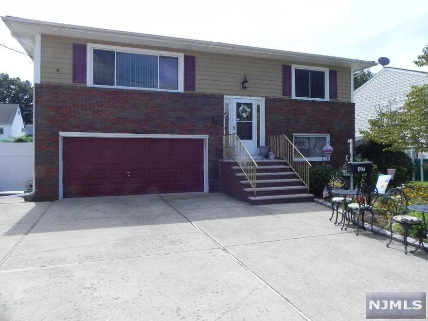 THIS BIG BEAUTIFUL 4 BEDROOM 3 FULL BATH HOME FEATURES ON THE FIRST FLOOR A LARGE LIVING ROOM, FORMAL DINING ROOM, KITCHEN, MASTER BEDROOM WITH A FULL BATH AND WALK IN CLOSET, 2 OTHER NICE SIZE BEDROOMS AND A HALLWAY FULL BATH. THE GROUND FLOOR HAS A FAMILY/DEN, EAT IN KITCHEN, BEDROOM, LARGE EAT IN KITCHEN, FULL BATH, LAUNDRY/UTILITY ROOM AND ENTRANCE TO THE BACKYARD. IF NEEDED THE GROUND FLOOR CAN BE USED FOR EXTENDED FAMILY. OTHER FEATURES OF THE HOME ARE A NEWER ROOF(2 YEARS OLD), NEWER GUTTERS(2 YEARS OLD) NEWER CENTARL A/C(2 YEARS OLD)AND NEWER SIDING(2 YEARS OLD)(WITH A LIFE TIME WARRANTY ON THE ROOF AND SIDING). THE HEATING SYSTEM IS 3 YEARS OLD. ALL HARDWOOD FLOORS ON THE 1ST FLOOR. 2 CAR GARAGE AND PLENTY OF PARKING. CLOSE TO SCHOOLS, SHOPPING, PARKS, NYC TRANSPORTATION AND MORE.