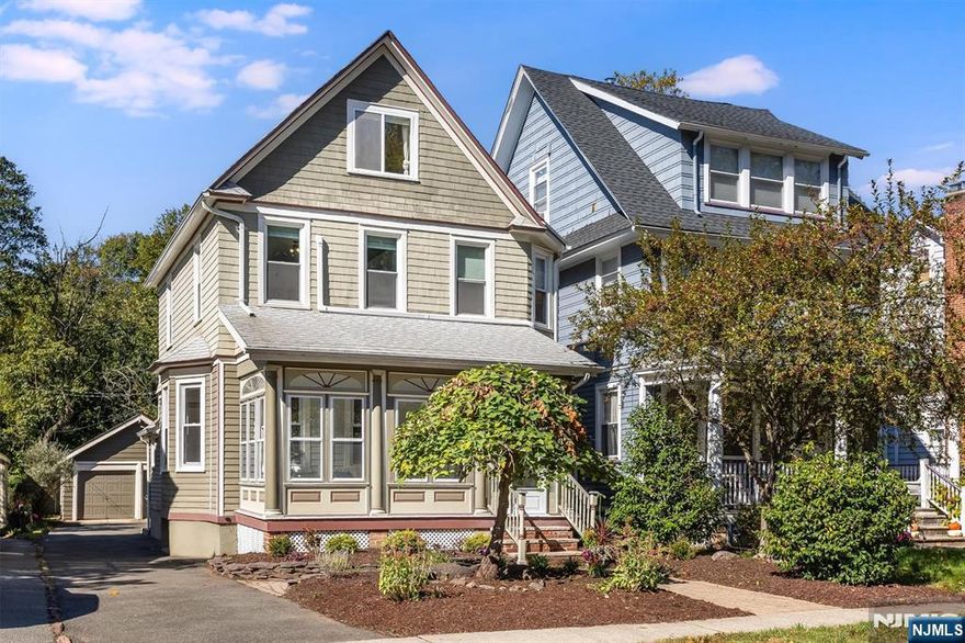 Prepare to fall in love! Step into the timeless charm and modern comfort of this beautifully maintained and freshly painted 3-bedroom, 2.5-bath Victorian in the Historic District. The sunny enclosed front porch adds three-season living space while it opens to a welcoming foyer with original stained glass and high ceilings, setting a warm, inviting tone.The main level features spacious living and dining rooms, a bright kitchen with granite countertops, stainless steel appliances, ample cabinetry, pantry, and an interior mudroom just off the kitchen. Hardwood floors and natural light highlight the home's period details throughout.Upstairs, the second floor offers two generous bedrooms and a sitting room/home office overlooking tree-lined views perfect for enjoying the seasons. The third floor hosts an additional large bedroom, ideal for guests or a private retreat. Bathrooms are located on the first, second, and basement levels. The home includes three ductless CAC units and a finished basement with extra living space/rec. area, full bath, and access to the beautiful private yard.Outside, enjoy a deep lot with private patio, lush garden, two-car garage, and parking for four additional cars. Conveniently located mile from 2 NYC-direct trains (Glen Ridge & Bloomfield) and near top-rated schools, parks, restaurants, caf s, and the town pool. Tthis home perfectly blends historic charm with modern livability.