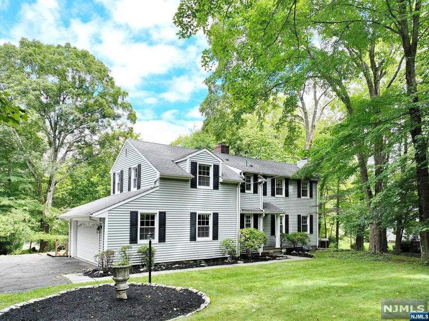 Nestled on 2 serene acres in Upper Saddle River this charming expanded colonial home on gorgeous property captures the essence of classic elegance and charm. Entry foyer with powder room, living room with gas fireplace, den/5th bedroom, dining room & Eat in kitchen, plus a sunroom/family room awaits, capturing the essence of the outdoors while providing a comfortable indoor space. The sunroom is a haven of tranquility, with vaulted ceiling & wall to wall windows that offer panoramic views of the surrounding landscape. Than there is the jacuzzi room with vaulted ceiling & skylights & sliders to deck leading to rear yard. The 2nd floor has 4 spacious bedrooms including Master suite with walk in closet & 2 double door closets.Master bath. Walk out finished basement with wood burning fireplace. Wood floors under carpets, Gas baseboard heat ,Central air 2 car garage , New septic in the works Home being sold as is! call Liz Ruckdeschel Coldwell Banker 201-522-4020