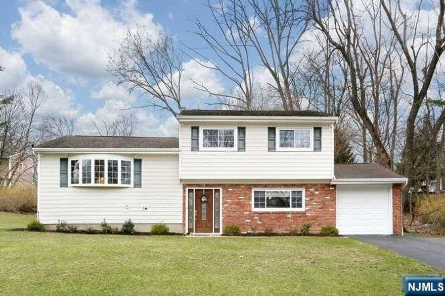 Move right in! Immaculate, well-cared for split in desirable Manito area. Entry foyer with new flooring & lge closet. Sizable living room with natural light streaming thru lge bay window. Wood floors flow into the formal dining room with oversized window and views of spacious yard. Eat-in kitchen offers tons of storage, warm wood cabinets & granite. Custom island adds more storage & prep space + casual counter seating! Upstairs a master bedroom w/entry to full bath & 2 additional bedrooms. Wood floors throughout! Entry level hosts large family room w/wood laminate flooring,2nd full bath & access to the patio & yard. Convenient laundry nearby in hallway. Basement & attic add tons of storage. Int painted 2023, AC unit 5 yrs, ext power-washed & lawn prof maintained. Located in a beautiful hilly, tree-lined neighborhood w/large 1/2 acre property. Don't miss this one!