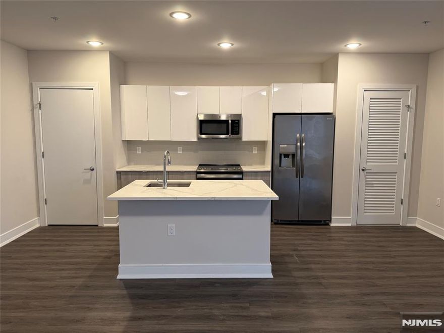 **ONE MONTH FREE on 13-month lease + one parking space included! - for occupancy commencing on or before 5/1/25!** Welcome to the Metro, Fort Lee's newest luxury building. All amenities INCLUDED in the rent, and REDUCED rent security offered to qualified applicants - The Metro features a variety of upscale, spacious floorplans. high-end residences fully equipped w/ modern kitchens w/ stainless steel appliances, quartz countertops, full islands & tiled backsplashes, open living/dining areas, shades on all windows, modern bathrooms & a full-sized washer & dryer in each unit. The Metro features a large elegant lobby, outdoor courtyard, outdoor terrace/garden, large club room and a on-site fitness center, which includes the Echelon Reflect mirror, electric car charging stations & INDOOR (covered) parking garage w/ direct elevator access to all residences for uncompromising security. Pet friendly (LB limit & fees apply)! Tenants pay ALL utilities. PARKING: 1st assigned garage parking space - $150/mo (excluding promotion) ; 2nd assigned garage parking space - $100/mo. Virtual tour available upon request!