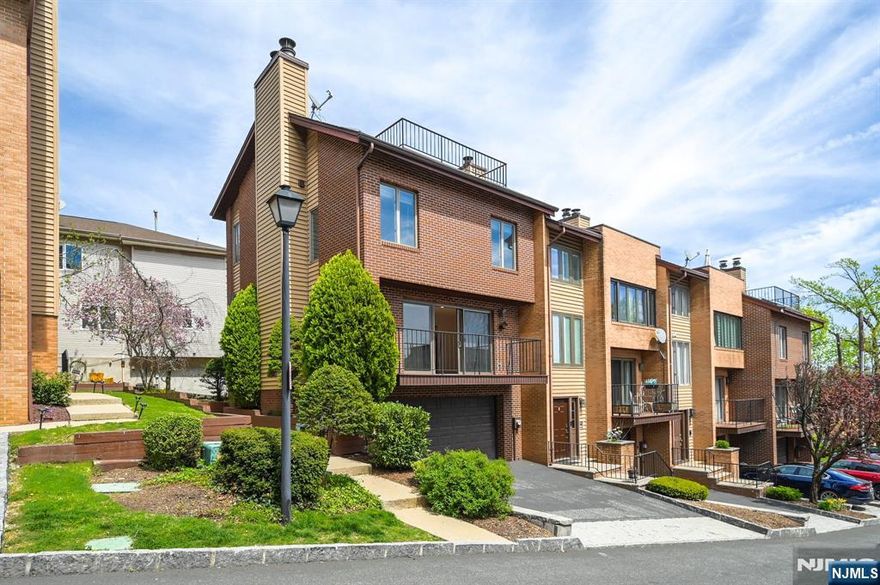 Rare opportunity to purchase in Yorkview Condos! This end unit 2/3 BR 2.5BA townhome is ready for you to call "HOME"! Beautiful views of NYC and the Hudson River from 2nd floor balcony and 3rd floor terrace, you will love the hardwood floors throughout, updated kitchen w/ss appliances, private rear deck off breakfast nook, fireplace in liv rm, 2 bedrooms and 2 full baths on 2nd level, and a 3rd floor bonus space which was used as a 3rd bedroom/office with a fireplace and fabulous terrace with amazing views! Ground floor has laundry and entrance to attached garage and driveway parking! Don't miss this gem!