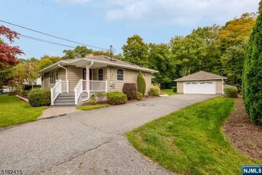 Meticulously maintainted custom home set on a large professionally landscaped lot backing woods. Much larger than it appears. Upgrades galore including generator transfer switch, vinyl shaker style siding, composite decking with vinyl railings, commercial grade gutters, paver patio, 3 season room with glass option for winter use, granite countertops and stainless appliances in kitchen, ..the list goes on. Full unfinished basement could easily be finished to increase living space even more. King sized master with full bath, large WIC plus a dressing room. Detached 2 car garage with loft storage, and workbench. PLUS huge shed with leanto. Dog run with doggie door.