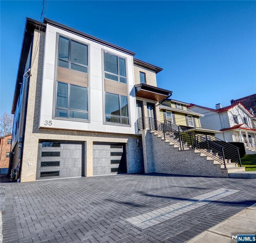 Discover this stunning 2 family home in the heart of Palisades Park, thoughtfully crafted with high-end finishes and a sleek, modern design. The first-floor unit features three generously sized bedrooms and 2.5 bathrooms. Designed for both comfort and style, this property provides unmatched convenience with easy access to shopping and effortless transportation to NYC.