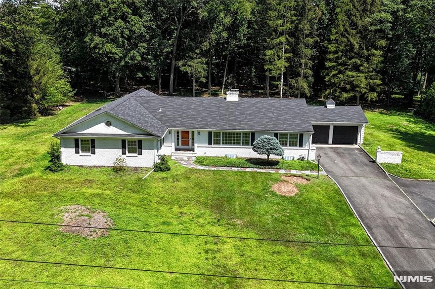 Nestled in the highly desirable Twin Brooks section of Chestnut Ridge, this classic ranch home enjoys an exceptional setting in prestigious Saddle River. The neighborhood is renowned for its tranquility and picturesque charm, featuring expansive, wooded, and private properties that offer both seclusion and natural beauty. This particular home and its grounds offer remarkable versatilityâ€”perfect for enjoying as-is, expanding to suit your needs, or serving as the ideal site to build the custom home of your dreams. A newly installed septic system has already been designed to accommodate a larger residence. Also an outstanding company, "Tinton Electric" in Fort Lee put in an 400 amp under ground electric service. This is a rare opportunity to establish yourself in one of New Jerseyâ€™s premier communitiesâ€”where luxury, privacy, and quality of life come together effortlessly.