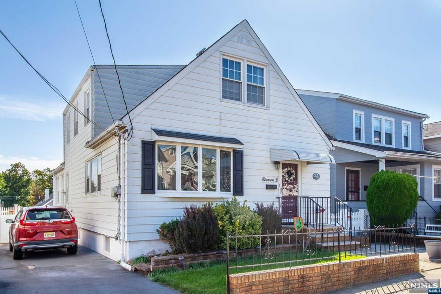 This charming and meticulously maintained 4-bedroom, 2-bath home feels incredibly homey and is larger than it appears! With 10-foot high ceilings, a recently renovated kitchen, and a fully finished basement, it offers plenty of living space. The property features four walk-in closets, a nice-sized private yard, and modern updates throughout. Conveniently located just 10 miles from Manhattan, with multiple NYC transportation options, shopping, houses of worship, and schools all nearby, this home is ideal for those seeking both comfort and accessibility!