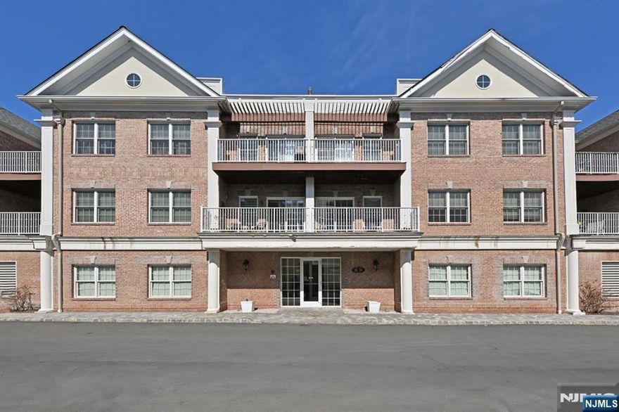 Beautiful 2 Bedroom, 1.5 Bath Condo at Paris Square, a prestigious 50+ Active Community! Enter into the elegant lobby with elevator. This top floor unit offers a beautiful granite kitchen with breakfast bar overlooking the living room and dining area with hardwood flooring. Main floor continues with a walk-in pantry, powder room, laundry closet, primary bedroom with private bath, and an additional spacious bedroom. Step outside on the large, inviting, private terrace. The lower-level offers the indoor parking space which is ideally situated as an end space (plenty of room). Also included is a large storage locker. Come and enjoy this upscale lifestyle with the elegant Clubhouse, fireplace, billiards room, fitness center and movie theater. Step outside to a covered picnic area, heated pool, bocce ball, putting green, enclosed garden area, additional large picnic area and walking paths. Plenty of guest parking and EV chargers. (HOA) includes onsite super, water, flood insurance, amenities, landscaping, snow removalâ€”come and enjoy this life of luxury and love where you live!