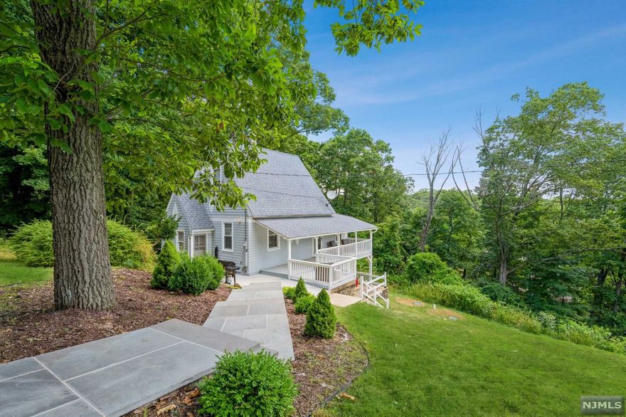 Welcome Home & Enjoy Lake Living in this Stunning 3 Bedroom Cape Cod! This beautiful move-in ready home has tons of features including a large deck w/ Year-Round Lake Views, 9 1/2 Foot Ceilings, Newer Kitchen w/ Granite Countertops, soft close drawers & stainless steel appliances, a walk-in pantry w/ mud room; the first floor offers wide vinyl plank flooring throughout + main floor bedroom w/ large closet & a full updated bathroom w/ wide subway tiled shower tub & modern fixtures. Upstairs offers 2 bedrooms + plenty of storage space. Lower level is partially finished w/ a walk-out to the spacious side yard perfect for entertaining. Some Recent Upgrades Include: Septic (2017), Updated Bathroom (2021), New HWH (Nov. 2021), New Masonry Steps (2021). Enjoy all that Lake Hopatcong has to offer! Boating, Fishing, Hiking, Water Skiing, & More! Conveniently located near shopping, schools, restaurants, & Route 80 + Mount Arlington Train Station!