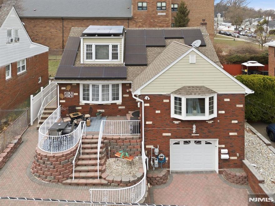 Exceptional and beautifully maintained two-family residence offering space, style, and modern upgrades throughout. This impressive property features 5 bedrooms and 3 full bathrooms, providing comfortable and versatile living. The first floor, renovated within the last five years, showcases a modern eat-in kitchen with quartz countertops, a charming coffee nook, and hardwood floors throughout, along with 3 bedrooms and 1 full bath. The second-floor unit offers 2 bedrooms and 1 full bath, with a kitchen updated in 2025. The finished basement adds valuable living space with a summer kitchen, family room, bonus room, and laundry area. Additional highlights include central air and heat throughout the home, newer windows, newer roof and siding, solar panels, water softener system, built-in speaker system, and a security system. The property also features an attached one-car garage, ample storage, and plenty of closets throughout the entire home. Enjoy outdoor living with a welcoming front terrace perfect for relaxing on summer days and a fully fenced backyard offering privacy and space for entertaining. A wonderful opportunity for owner-occupants or investors seeking a move-in-ready property with modern upgrades.Conveniently located near NYC.