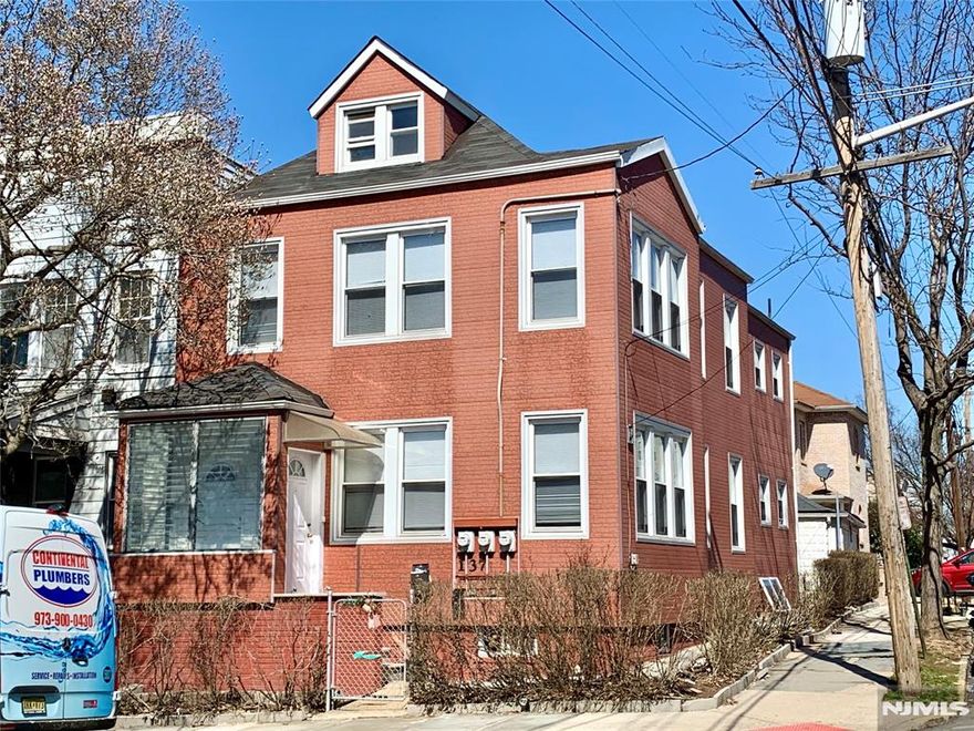 Corner property with 2 spacious apartments (total 2,838 sf). Good sized rooms. 1st floor with living room, 3 bedrooms, 1 bath, new vinyl plank floors in living room and hallway, laminated floors in 2 bedrooms, ceramic tiled floors in kitchen, bath & one bedroom, Quartz countertop in kitchen. 2nd floor with living room, dining room, 2 bedrooms, 1 bath, laminated & ceramic tiled floors, Quartz countertop in kitchen, Ductless airconditioners in living room and bedrooms. Both apartments painted & updated a year ago. Walk up stairs to large finished attic. 2 sets of washers & dryers in basement laundry room. 2 brand new water heaters. Roof & heating boilers 13 years old. Patio & 2 garages in back of house. Oil tank under sidewalk on Maple Street removed in 2000 with permit. Convenietly located near restaurants, shops, and public transportation. Shuttle bus to Harrison Path Station & Bus #109 to New York Port Authority a block away. Most photos taken before current tenants moved in last year.