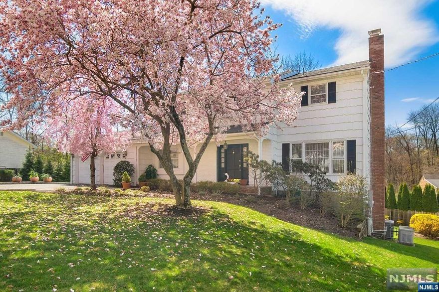 Spectacular Home in Wayne!This is one of the most desirable lots in Tall Oaks area!Abolutely,Fabulous,Colonial Home-Thoughtful modern touches and convenient built-ins add character.First floor features a formal dining room,living room w/wood burning fireplace,family room & kitchen with soaring ceilings, laundry room with separate real entrance, powder room, granite counter tops and two french doors that leads to spacious deck perfect for entertaining.This lovely home offers 4king-sized bedrooms with 2full bathroom all located on the second floor with hardwood floors under carpet. Large Finished Lower Level displays with High ceilings,Rec/Room,Two bonus Rooms with closets/Offices,Full Bathroom,with separate outside entrance,tons of storage.Backyard is level and offers plenty of space for all your outdoor needs,sprinkle system water the lawn&flowers.Shed for additional storage.Multi zone heat and 3zone A/C.Enjoy security with Generac Generator powered by natural gas whole house.