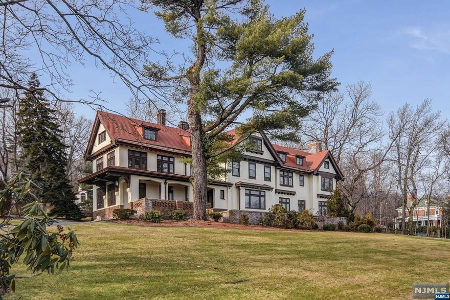 This handsome Tudor sits majestically on nearly 2 acres & gazes lovingly at the spectacular NYC skyline! Elegant turn of the century home replete with architectural details- leaded glass windows, dentil moldings, 6 fireplaces, beamed ceilings & gorgeous woodwork! Gracious living room, formal dining room,library & solarium on eratorfirst floor. Chefs kitchen/center island, Bosch appliances, sub zero fridge & freezer & large dining area. Primary suite with 2 walk in closets & a full ensuite with shower stall, jetted tub & double sinks. A 2 room corner office suite with a WBFP offers generous accommodation. Play from home- in the yoga studio, work out in the home gym, play a game of pool, or taste the samplings of the wine cellar in cafe Robert! Full walk out basement, first floor powder room, 2nd floor laundry, central air, underground lawn sprinklers (water provided by own well), canine containment system & a generator. Sprawling green spaces, balconies & patios &gorgeous vistas!
