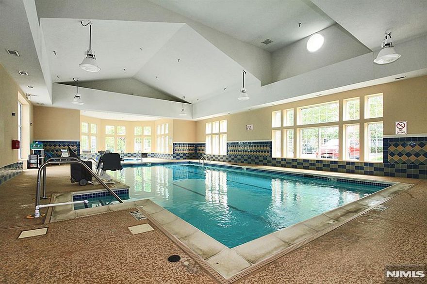 One of the MOST DESIRABLE BUILDINGS - steps from the Clubhouse. Resort-style living with Luxury, comfort & convenience in this 55+ community with 24-hour gated security. DEEDED GARAGE & TOP FLOOR W/MT VIEW. Ideally located just steps from the clubhouse, this spacious top-floor 2 bedroom, 2 bath residence offers thoughtful design & elegant living throughout. The bright eat-in kitchen provides ample space for a table & chairs. Large utility room offers abundant storage with a conv. located washer/dryer. French doors just off the formal DR open to a versatile den â€” ideal as a cozy family room, home office, or guest space. The inviting LR filled with natural light & feat SGD that lead to a covered balcony â€” the perfect spot to enjoy morning coffee while taking in the mountain views or relaxing at day's end. The primary suite is a peaceful retreat, highlighted by a tray ceiling and a spacious WIC. The spa-inspired en-suite bath incl walk-in shower w/built-in seat, double vanity sinks, and private water closet. Indulge in the wealth of amenities: clubhouse, fitness center, steam/sauna rooms, indoor/outdoor pools, arts/crafts studio, movie theater, library, walking & biking trails, bocce ball, tennis courts, restaurant, card room, ballroom, billiards, and more. Don't let this opportunity pass you by experience the unrivaled lifestyle that this exceptional condominium has to offer. New hot water heater will be installed. Move right in and start enjoying the lifestyle you deserve.