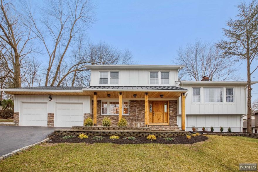 Stunning, spectacular, inspiring, are just a few words that come to mind the minute you pull up to this wonderful home. Curb appeal accentuated by board and batten siding solid 8 x 8 columns supporting the porch dressed with a cedar ceiling and a metal roof - this is just the beginning of your experience. Enter the home and you immediately see an open floor plan, blending the dining room into an incredible chef's kitchen with high-end commercial grade Jenn-air appliances. Center island offers a copper prep-sink, under-counter microwave drawer, and wine cooler. The mudroom is accented by farm doors, hand-made from distressed wood, an exposed beam, and shiplap boards to create this true, one of a kind. All new bathrooms, new & refinished floors, and much more make this home just perfect.