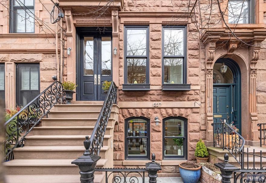 Immaculate four-story plus cellar single-family townhome located on one of Hoboken's most prestigious tree-lined blocks right in the heart of the uptown Hoboken brownstone district. This three-window-wide home sits on a 16'x100' lot and offers luxurious interior living space over four above-grade levels as well as stunning outdoor spaces with a mature terraced back garden and a cellar for storage and mechanicals. Expanded from its turn-of-the-century footprint with a two-story extension, the first 2 levels of the home feature unique floor-to-ceiling stainless-steel-framed windows that fill the home in sunlight. The residence is stunning, showcased by the design of J Patryce Design & Co. and remarkable old world craftsmanship including a distinctive brick and brownstone facade and restored original curved staircase with mahogany handrail. Conveniently located 5 minutes from Hoboken's 14th Street NY Waterway Ferry & blocks to Washington St for transit, shops, and restaurants.