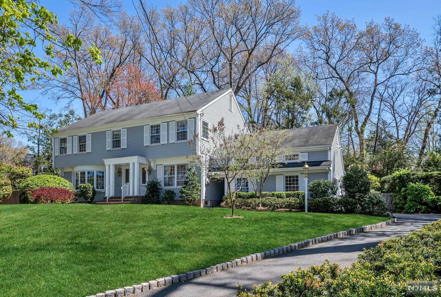Set on a gentle knoll on a quiet tree-lined street in the coveted Willard School neighborhood, this center hall colonial with timeless architecture is a gem. Rarely can you find 5 spacious second-floor bedrooms each with custom closets, in addition to a stunning living room with a beautiful bay window, a formal dining room with picture moldings, a handsome family room with fireplace, beamed ceiling, and a large bright kitchen with room for a large table, walk-in pantry and updated stainless appliances. From the kitchen or family room, you can step out to the commanding bluestone patio which overlooks the heated gunite saltwater pool. Lush greens and trees create a one-of-a-kind setting for an afternoon by the pool or entertain a large group on a grand scale. Other features include a generator, underground sprinklers, Bud Vac, water filtration system, safe, garden shed, HW floors throughout and easy commute. This classic home is ready for your touches!