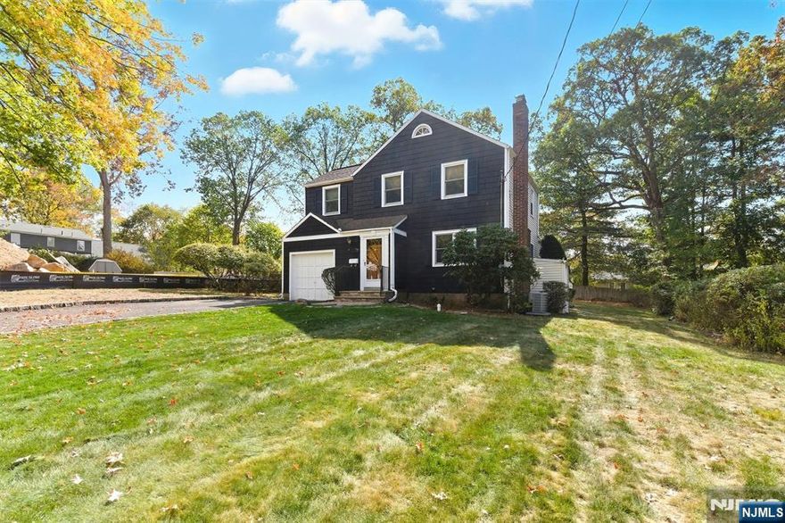 Welcome To This Inviting Colonial Nestled In One Of Livingston's Premier Million to Two Million Dollar Neighborhoods. This Home Features Three Comfortable Bedrooms, Including A Spacious Primary Suite And Generous Closets Throughout. Gleaming Hardwood Floors Flow Through Every Room, Creating A Warm And Timeless Feel. The Bright Kitchen Offers A charming Breakfast Nook With Sliders Leading To A Newer Wraparound Composite Deck Complete With An Automatic Awning, Perfect For Outdoor Dining or Relaxing. The Living Room Has A Wood Burning Fireplace Open To The Dining Room. A Wonderful Grand Family Room Was A Very Desirable Addition To This Home!! Additional Highlights Include Two Full Baths, One Half Bath, Updated Windows, A Newer Sewer Line, And An Attached Garage. The Partially Finished Basement Offers A Recreation Room, Tool Room, Full Bath And Storage. Located Just Blocks From The Hillside Elementary School And Minutes From Livingston's Vibrant Downtown Shopping, Dining, And Banking. A Wonderful Opportunity To Own A Home Surrounded By Elegance And Convenience.