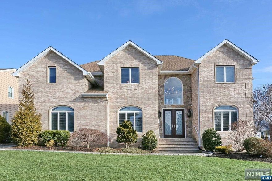 Beautiful 4,600 square foot custom built colonial style home on an oversized lot (80 x 112) and on a cul-de-sac. 1st floor features a 2 story entry foyer, formal living room, family room, den w/custom 14 foot wet bar, eat in kitchen w/subzero fridge and all new appliances, dining room w/fireplace, and an office that can be the 5th bedroom. 2nd floor features a large primary bedroom suite w/cathedral ceilings & fireplace, 3 more bedrooms, laundry room w/new washer & dryer, and a full bathroom. Their is also a full cedar lined attic for plenty of storage. Basement is finished with 10 foot ceilings and a full bathroom w/steam shower. Additional features of the home include detached garage w/driveway parking for 5 cars, in ground salt water pool, outdoor jacuzzi, marble tile floors, hardwood floors, multi zone heating & ac, new french drains & sump pumps, 5 security cameras, front & back yard sprinkler system, and all new landscaping.