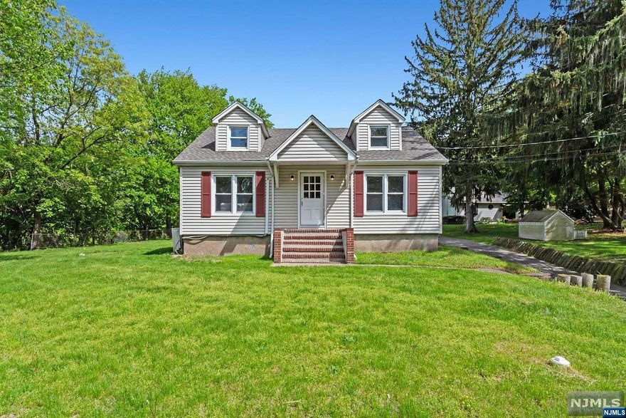 Welcome to Franklin Lakes! With plenty of natural light and an abundance of charm, this beautiful home is dressed to impress with a brand new roof, gut renovated bathrooms, new hardwoods on the first floor, new carpeting on the second floor, new heating system and new tankless water heater! With garage parking for 3 and a walkout, finished basement, this home hits all the right notes. If Franklin Lakes is where you want to be- look no further than this beautiful home!