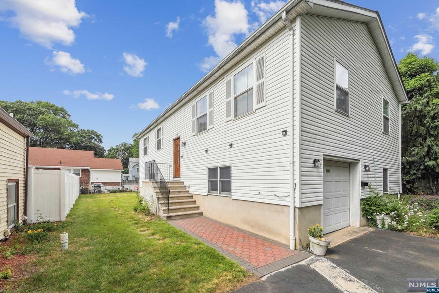 PLEASE CALL WAYNE ADLER: 201-452-4548 or SUSAN PENNY: 201-370-2000 FOR EASY SHOWINGS ---------- GREAT OPPORTUNITY TO OWN THIS BEAUTIFUL 5 BEDROOM, 3 FULL BATHROOM BI-LEVEL HOME WITH ROOM FOR YOUR EXTENDED FAMILY. THE FIRST FLOOR HAS A LARGE MODERN EAT IN KITCHEN WITH GENEROUS STORAGE SPACE, LIVING ROOM, DINING ROOM, PRIMARY BEDROOM WITH FULL BATHROOM & SLIDING GLASS DOOR LEADING ONTO A LARGE DECK OVERLOOKING THE BACKYARD, 2 MORE BEDROOMS AND A FULL BATH. LOWER LEVEL HAS GROUND FLOOR ACCESS FOR AN EXTENDED FAMILY WITH KITCHENETTE, 2 LARGE BEDROOMS, FULL BATHROOM, FAMILY ROOM WITH SLIDING GLASS DOOR TO THE YARD,LAUNDRY AREA, AND CONVENIENT ACCESS TO THE GARAGE. CENTRAL AIR CONDITIONING, BASEBOARD HEATING, JUST STEPS AWAY FROM NYC TRANSPORTATION, CLOSE PROXIMITY TO MANHATTAN, SCHOOLS, DOWNTOWN SHOPPING AND HOUSES OF WORSHIP.