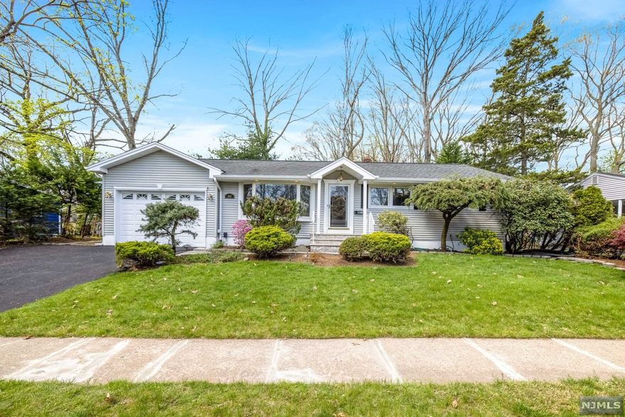 Completely move-in-ready and spacious Ranch in the heart of Washington Township! Situated on a quiet street, this appealing home features 3 bedrooms & 2.5 bathrooms. Freshly painted throughout, with gleaming hardwood floors and an open concept kitchen that flows directly into your Living / Dining Room, with a charming wood burning fireplace. Excellent layout for entertaining plus brand new Stainless Steel Appliances. 1/2 bathroom for your convenience off of the kitchen. The basement is finished, with plenty of room for storage, plus your 2nd full bathroom. Spacious and Sunny backyard with a Trex Deck. Oversized 1 car attached garage large driveway. You will love this home. Do not miss! HIGHEST & BEST DUE TUES MAY 3 @ 12pm!