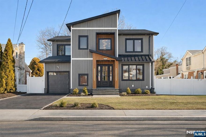 Modern elegance with architectural detail-5BR, 5BA new construction on a new and existing foundation, showcasing exceptional craftsmanship and offering 3,500+ sq ft of finished space, this home delivers elevated living in a prime Fair Lawn neighborhood. The open layout features a first-floor bedroom and full bath, mudroom, and expansive living and entertaining spaces with French doors leading to a partially covered deck for seamless indoor/outdoor flow. The statement kitchen offers quartz island, countertops and stainless steel appliances. The serene primary suite includes dual walk-in closets and a spa-inspired bath. Three additional bedrooms, two full baths, and a laundry room complete the upper level. Finished basement with full bath provides flexible space for a gym, media room, or home office. Conveniently located near top schools, NYC trains and buses, parks, dining, shopping, and houses of worship, this home perfectly blends luxury and lifestyle.