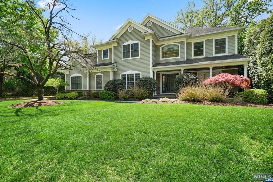 HIGHEST AND BEST DUE BY 5PM TUESDAY 5/2. 5 bedroom 4.5 bath home on the East hill of Demarest offering an ideal floor plan & great outdoor living. Greeted by a grand 2-story entry flooded w/nat light. The main FL boasts a LR w/French doors opening to a charming covered porch. A sunny kitchen has SS appliances, ample center island, tons of storage & bkfast area open to a generous GR w/coffered ceiling, massive windows & stone surround fplc. Work from home in your 1st-flr office w/custom built-ins. Upstairs are 4 generously sized BRs including an ensuite BR w/WIC, 2 addl BRs, hall bath w/dbl sinks & lndry rm. Enjoy a dreamy primary suite w/tray ceiling, large sitting rm, 2 WIC's & renovated hotel like bath w/dbl sinks & water closet. The LL won't disappoint boasting a fabulous gym/5th BR, full bath, rec area, ample storage & wine rm. A Staycation backyard oasis for entertaining & relaxation w/covered outdoor family rm; stone wood-burning fplc,outdoor TV & ceiling fan.