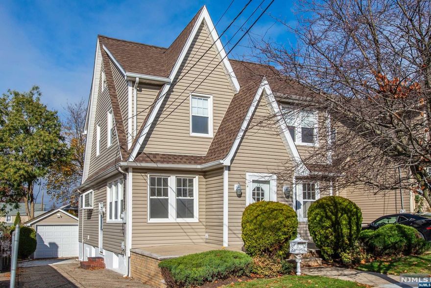 Nestled in one of the most sought-after streets in Garfield,this 3-BDRM COL exudes timeless charm & character.LRG open porch extends warm invitation.Stepping thru front FOYR,you'll be greeted by arch DRWYS,complemented by exquisite CRWN MLDG & chestnut WD trim.HDWD FLRS on 1st & 2nd levels are concealed under CPT.Massive LR stretches across width of home w/stunning stained glass WNDWS.FDR,w/its chair molding,exudes air of sophistication,creating perfect ambiance for elegant dinners.Heart of home,a sun-drenched generous sized KIT w/abundance of CNTP,CABS & PAN CLOS,haven for culinary enthusiasts.LRG DK w/bench seating extends from KIT,providing picturesque vantage point to enjoy PRIV BKYD,perfect for serene moments or lively outdoor fun.2nd FLR reveals 3 LRG BDRMS bathed in natural light,while hall BTH boasts custom vanity SNK.Attic,sprawling across top FLR, holds untapped potential.BSMT, w/its versatility & multiple rms,includes WRSHP, HB & offers endless options.1 Car GAR w/ElEC.
