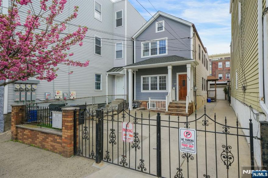 Welcome to 172 Chestnut Street, an incredible two-family opportunity in Newark's ultra-sought-after Ironbound neighborhood! This versatile and income-producing property is perfect for investors or a savvy buyer seeking long-term value! The updated exterior, covered front porch, and wide concrete driveway reflect the care and upkeep throughout the home! The first-floor unit features two bedrooms, a sun filled living room, spacious eat-in kitchen, and a full bathroom. This unit is equipped with central heating and cooling, offering year-round comfort. The second-floor unit offers a similar layout with two bedrooms, a bright living area, full bathroom, and an eat-in kitchen, complemented by central cooling and baseboard heating. The walk-out finished basement adds valuable bonus space, complete with a recreation area, full bathroom, and laundry room! Outside, the property truly stands out with a wide driveway and garage perfect for additional storage - an undeniable premium in the Ironbound! This property checks all the boxes with its prime location and thoughtful updates! This is a rare find in a vibrant, in-demand neighborhood! Just minutes from the Ironbound's best restaurants, shops, and everyday conveniences! Plus easy access to Newark Penn Station and Newark International Airport - this home makes commuting a breeze!