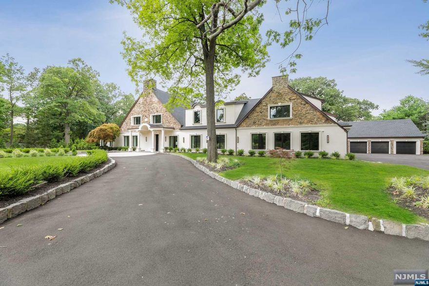 The original Stone Manor House of Glen Goin situated on 1.86 park-like acres, features approximately 9,000 sq.ft. of gut renovated space. Completed in 2022, this home features beautifully proportioned reception rooms and modern architectural detailing. The main level contains a huge foyer with a sweeping staircase, beautiful gourmet chef's kitchen, banquet-sized dining room, great room, wine room, office, and second kitchen adjacent to an indoor family room/cabana. The second level has a large primary suite, plus four additional large bedrooms. The property features a sweeping circular driveway, gunite pool with stone terraces, and a carriage house with a 4-gar garage and large upper level loft.