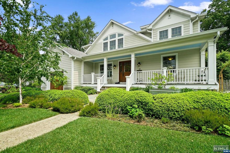 HIGHEST AND BEST OFFERS DUE TUES 6/27 BY 11AM. Welcome to this lovely move-in-ready 5 BR 3.5 bath home. Enjoy beautiful landscaping while lounging on your covered front porch or entertaining friends in your lush BKYD. A naturally lit open floor plan & gleaming hardwood floors greet you. The EIK is enhanced by a skylight w/vaulted ceiling & glass doors to the yard. Flowing from the EIK, a perfect family room ft a lrg bay window & stone fplc. A deluxe mudroom w/heated floors fts a butler's pantry, WIP, 1/2 bth + access to an oversized 1 car garage & backdoor. A convenient & beautiful 1st flr BR suite & updated full bath will impress. The 2nd lvl boasts a spacious primary suite fitted w/Heated floors, vaulted ceiling, 2 WICs & hotel like bth w/Dbl vanity, oversized shower, heated floor & private balcony. Completing the 2nd level are 3 BRs & full hall bath. LL offers endless possibilities w/a large open area that can be customized to suit your needs & laundry RM. BKYD is a true oasis.