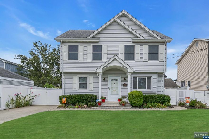 As you enter this charming home, you're greeted by a cozy living room featuring an electric fireplace, setting the perfect ambiance. The elegant dining room is complete with crown molding and gleaming hardwood floors. On the main level, there's a versatile bedroom that could double as a home office, along with a full bathroom. The galley-style kitchen boasts granite countertops, stainless steel appliances, and ample cabinet space, making it both functional and stylish. The finished basement is ideal for entertaining, offering a TV room with a bar and a separate area perfect for a guest bedroom. You'll also find a laundry room and a convenient half bathroom on this level. Upstairs is a cozy bedroom with wall-to-wall carpeting, along with a bonus room featuring hardwood floors. Down the hall is a full bathroom with a stand-up shower, granite countertops, and generous storage space. The master bedroom at the end of the hall includes a spacious walk in closet with custom shelving.