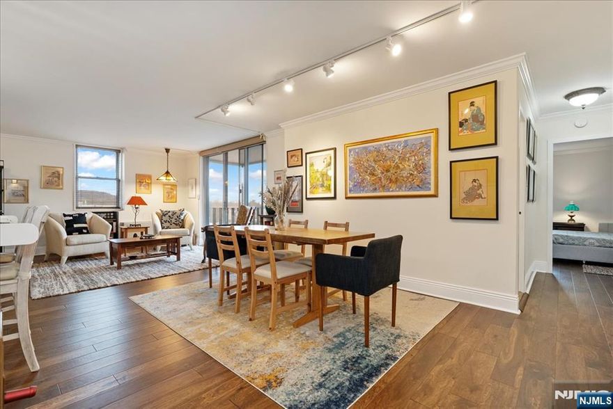 Gorgeously updated, top floor, corner unit with soaring views! This rare L-shaped unit allows incredible views in three directions! The Kitchen gleams with modern cabinetry, SS appliances, and an open view over the granite breakfast bar to the dining room and balcony. The unusual layout allows for multiple seating areas, plus formal dining area. The Bedroom is large with a wall of closets, windows on two sides and a stunning, mountain view. Updated Bath w/ frameless glass shower. Unbelievable closet space including two walk-ins. There's the private, screened porch, with unbelievable wrap around views! Laundry next door is the ultimate convenience. Two-zone heating/cooling and HOA includes all utilities. Right in the heart of Upper Montclair Village, the sought after Bellaire House is the only building in Montclair to offer 24 hour attended lobby, elevators, indoor & outdoor parking, private pool, outdoor seating area and dog run. Pets permitted (with limits)! Opportunity knocks!