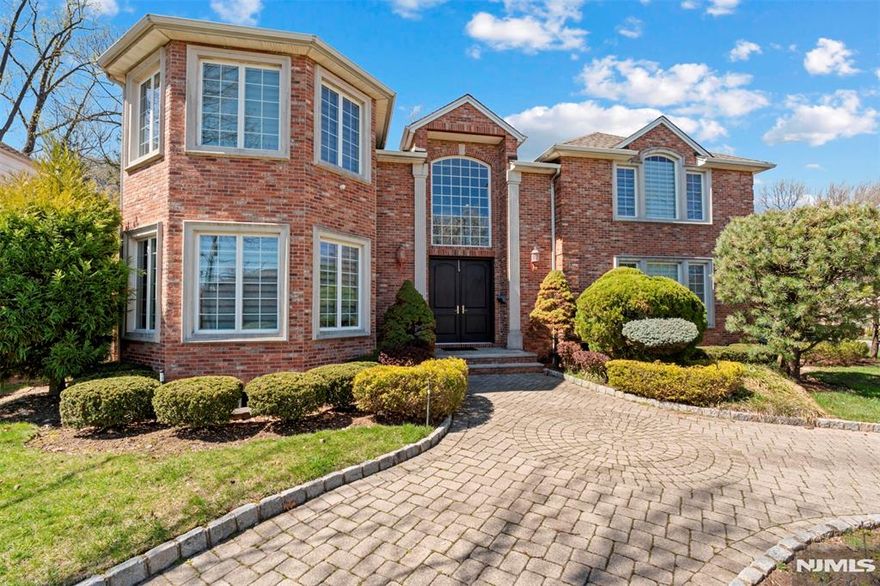 Welcome to this exquisite all- brick central hall colonial fabulously situated on a corner lot in the prestigious North Cliffs. This 5BR, 4.5BA home offers an exceptional blend of luxury living & thoughtful design. From the moment you step in you'll be captivated by the expansive open layout, ideal for both casual living and elegant entertaining. This home offers a modern floor plan with sunlit rooms, a two-story entry foyer with radiant heat tile floors , and a private guest room/office. The oversized gourmet kitchen with a dining area and French doors leading to the backyard are perfect for enjoying a peaceful outdoor living. The soaring great room with a fireplace and formal dining room with a w/butler's pantry incl. wine storage & fridge make this home an epitome of entertaining. The upper level offers a primary bedroom with a private office, primary bath with a jacuzzi and three spacious bedrooms with J&J bathroom and additional full bath. The finished basement is designed for relaxation and fun, with an extra bedroom and full bath perfect for accommodating visitors with comfort and privacy. The yard offers a paver patio, privacy trees, & 3 car heated garage. Easy commute to NYC