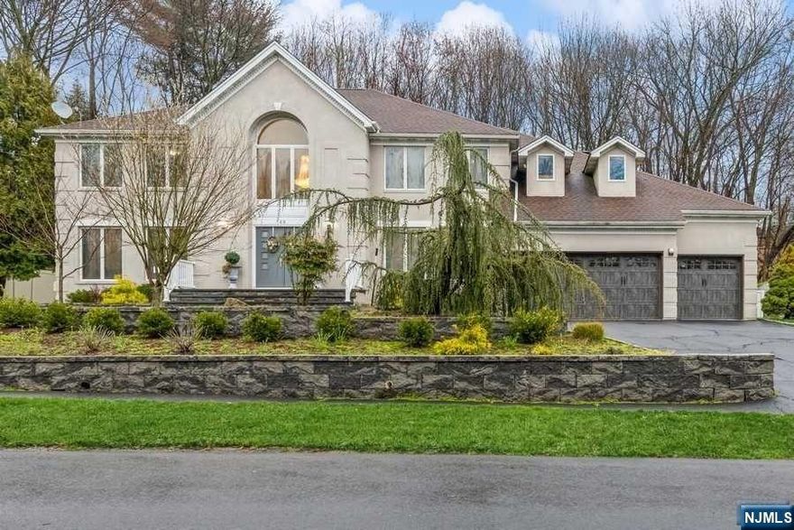 A fully renovated colonial nestled in the prestigious East Hill of Closter presents approximately 4,800 square feet across its first and second floors, complemented by an additional 2,300 square feet on the lower level. The main level showcases a grand foyer, formal living room, dining room, and an impressive great room featuring cathedral ceilings alongside a gourmet kitchen equipped with custom cabinetry and top-of-the-line appliances. Also on this level are a guest suite, a generously sized office, and a powder room. Ascend to the second floor to find the primary suite, two bedrooms connected by a Jack and Jill bathroom, another bedroom with a bonus room, a family bathroom, and a laundry section. The fully finished basement offers a home theater, recreation area, office, music room, full bathroom, garage access, and abundant storage space. Enjoy blue ribbon schools, nearby amenities, and easy NYC access.