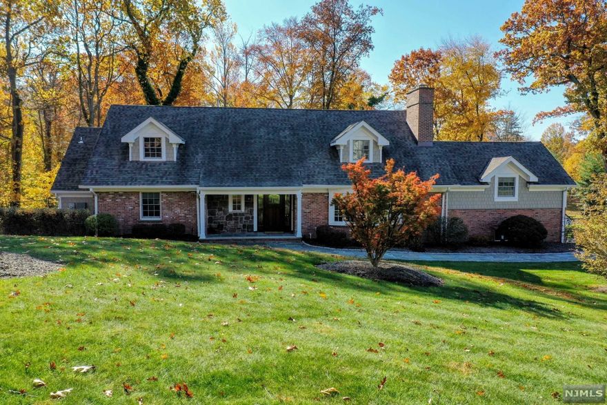 Picturesque Williamsburg Colonial on beautiful property, meticulously maintained, elegantly classic, pride of ownership w/so many updates since 2014! Beautiful flagstone walkway, living rm w/FPL, open to FDR w/private French door to patio, steps up to warm fam rm w/stone fpl (not used), updated chef's kitchen w/top-of-the-line appliances, cherry cabinetry & addl entrance to backyard dining on expansive patio w/built-in gas grill overlooking sprawling backyard & woods overlooking St. Gabriels Brook. 1st flr MBR/updated MBTH w/adjacent home office (originally 4th BR) & PR (originally FBTH) for easy one floor living. 2nd flr boasts 2 lrg BRs (potential for addl ensuite bth directly above MBTH), updated FBTH, cedar closet. Partially fin BSMT w/tile flr, lrg lndry rm & addl FBTH. 3-Car garage (dbl bay heated) & lrg workroom behind single bay. Recessed lighting, alarm/cameras, sprinklers, speakers, generator. Newer roof, windows, siding & heating system. Just move right in & enjoy!