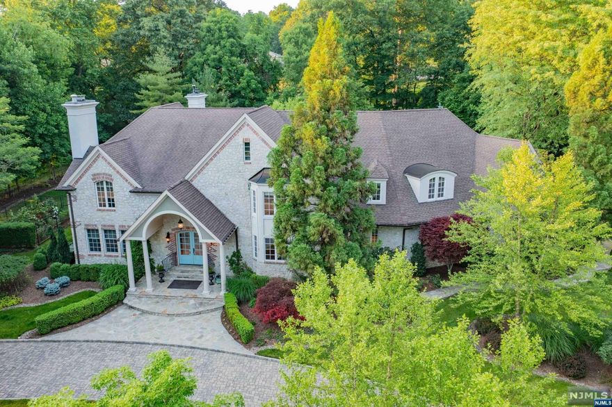 Nestled on a private culdesac sits this grand estate, with its stunning curb appeal & lush mature landscape. Enter into a grand 2-story EF w/sweeping staircase & extensive mill work. Inviting LR w/ FP, banquet size DR, custom library w/ paneled walls, FP & coffered clg. A fabulous 2-story great rm w/ FP & French doors to patio opens to a dream kitchen with oversized seated island & high end applncs including Wolf, Fisher & Paykel, Miele, & Viking, butler's pantry, built in coffee station & breakfast rm w/ walls of windows. Custom mud rm, laundry rm, BR w/ full BTH, PR, and 3-car garage access complete main lvl. The primary suite will wow you w/ double door entry, tray ceilings, 2 WICs, luxurious bth w/ jetted tub & oversized tile shower, connected to bonus room w/ butlers pantry. 4 large BRs, 1 ensuite & 2 J&J BTH. Enormous lower lvl offers endless possibilities. Gorgeous grounds w/ plantings, garden, & 2 paver drvwys. Portable generator, heated garage. Luxury living at its best.