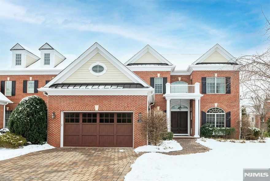 This exquisite end unit offers a sophisticated blend of elegance & modern living w/all the upgrades you want. A grand 2-story entry welcomes you into an open-concept living space, a banquet-sized DR, LR/office w/ pocket doors, & an inviting great room w/gas FP. The kitchen is a dream, w/high end appliances including a 36 in Wolf range & oven, Bosch DW, & large walk-in pantry and butler area. Breakfast rm w/sliders to rear patio, mud rm w/ built-ins & WIC, laundry rm, PR & entry to 2 car garage complete the 1st fl. The 2nd fl offers an large primary suite w/FP, spa-like bathroom & 2 WICs. The 2nd level also includes 2 large en-suite bedrooms. The lower lvl living space showcases a large rec rm, media area, & game rm w/ full bath. Custom mill work, hardwood flrs & generator. Elevator to all 3 floors! Enjoy the convenience of living in the gated Saddle River Grand w/ luxury amenities incl clubhouse, health club & custom pool. The epitome of luxury.