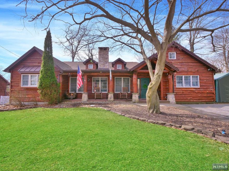 Unique Log Cabin in desirable Pines Lake section of Wayne! Covered front porch overlooks quiet dead-end street! Original charm runs throughout the entire house! Greet guests in the entry foyer which leads to living room with vaulted ceilings, skylight and wood burning fireplace. Formal dining room is a great place to host guests or just enjoy as quiet night at home. Kitchen offers ample cabinet storage, island, separate dining area and sliding glass doors that lead to the large rear deck. Family room offers wet bar and sliding glass doors also leading to the deck, which allow plenty of natural light to fill the room. Primary bedroom offers vaulted ceilings and en suite with stall shower and storage vanity. 2 additional bedrooms and 2 full bathrooms complete the main living space. Partially finished basement offers den area, storage, laundry hookup and walkout to covered paver patio. This backyard is perfect for outdoor entertaining during the warm summer months.